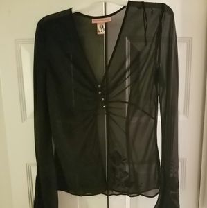 Sheer blouse with flower embroidery on sleeve.